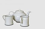 Glass And Kettles Is Made From Ceramic Tile On A White Background With Clipping Path Stock Photo