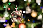 Glass Bell Of Reindeer Ornament Hanging On Christmas Tree Stock Photo