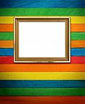 Gold Picture Frame On Colorful Wood Stock Photo