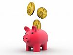 Golden Dollar Coins Falling Into A Pink Piggy Bank Stock Photo