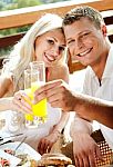 Good Morning - Couple Having Juice Smiling Stock Photo