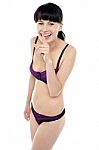 Gorgeous Bikini Model Gesturing Silence With A Smile Stock Photo