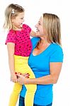 Gorgeous Mother Holding Her Beautiful Daughter In Arms Stock Photo