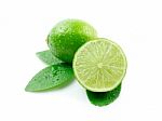 Green Limes With Leaves On White Stock Photo