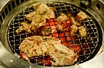 Grilling Pork On Grill Stock Photo