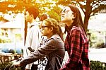 Group Of Asian Teenager Walking In The Park  Stock Photo