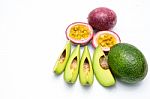 Group Of Avocados And Passion Fruit Isolated On A White Background Stock Photo