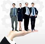 Group Of Business People Standing On Palm Stock Photo