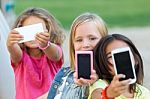 Group Of Childrens Taking A Selfie In The Park Stock Photo