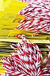 Group Of White And Red Ropes With Yellow Cards Stock Photo