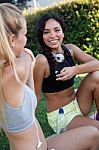 Group Of Young Women Doing Stretching In The Park Stock Photo