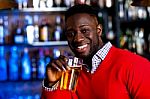 Guy Drinking Beer In A Nightclub Stock Photo