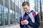 Guy Enjoying Music On Street Stock Photo