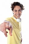 Guy With Headphones Pointing Stock Photo