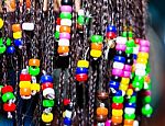 Hair Braiding With Colorful Beads Stock Photo