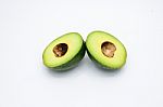 Half Of Green Avocados Isolated On A White Background Stock Photo