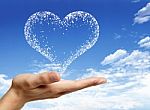 Hand Holding Heart Shaped Cloud Stock Photo