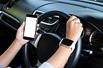 Hand Holding Phone White Screen And Driving Car Stock Photo