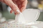 Hand Picked A Wet Wipes In Package Box, Wet Wipes In A Woman's H Stock Photo