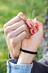 Hands Of A Couple Held Together Stock Photo