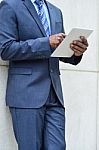 Hands Of The Businessman Using A Tablet Pc Stock Photo