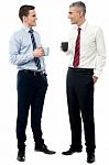 Handsome Business Executives Toasting Coffee Stock Photo
