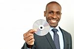 Handsome Businessman Holding A Cd Stock Photo