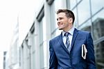 Handsome Businessman Holding A Newspaper Stock Photo