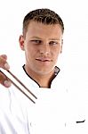 Handsome Chef Holding Chopsticks Stock Photo