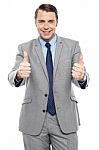 Handsome Executive Showing Double Thumbs Up Stock Photo