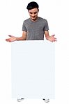 Handsome Guy Behind Blank Ad Board Stock Photo