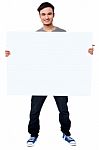 Handsome Guy Holding Blank Ad Board Stock Photo