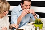 Handsome Male Enjoying His Delicious Sandwich Stock Photo