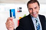 Handsome Male Executive Holding Cash Card Stock Photo