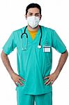 Handsome Male Nurse With Hand On Hips Stock Photo