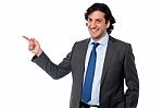 Handsome Male Professional Pointing Away Stock Photo