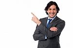 Handsome Male Professional Pointing Away Stock Photo