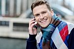 Handsome Man Using His Mobile At Outdoors Stock Photo