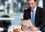 Handsome Manager Reviewing Business Updates Stock Photo