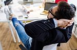 Handsome Young Businessman Relaxing One Moment In The Office Stock Photo