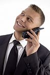 Handsome Young Businessman Smiling And Talking On Phone Stock Photo