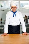 Handsome Young Chef Posing In Uniform Stock Photo