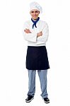 Handsome Young Chef Posing In Uniform Stock Photo