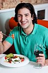 Handsome Young Guy Enjoying His Meal Stock Photo