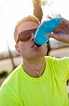 Handsome Young Man Drinking After Running Stock Photo