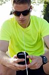 Handsome Young Man Listening To Music After Running Stock Photo