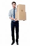 Handsome Young Man With With Stack Of Boxes Stock Photo