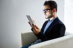 Handsome Young Man Working With Digital Tablet In The Office Stock Photo