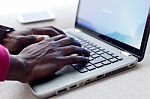 Handsome Young Man Working With His Laptop At Home Stock Photo