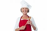 Happy Aged Chef Holding Wooden Spoon Stock Photo